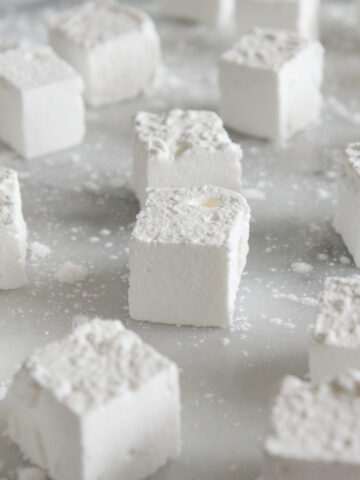 side view of marshmallows on a marble surface