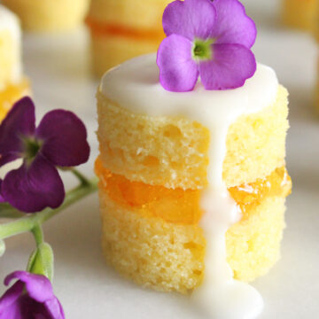 These mini naked cakes filled with sweet and tangy orange marmalade and garnished with fresh flowers are an elegant treat for a springtime brunch. They may look fancy, but they're simple to make.