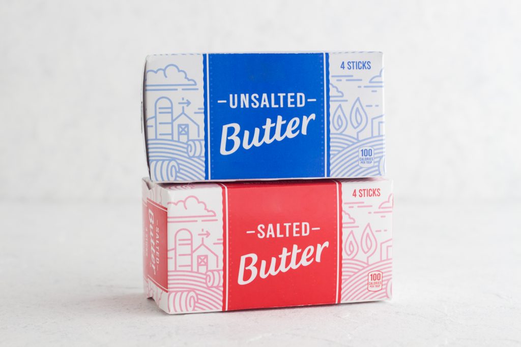 butter boxes stacked on a white surface