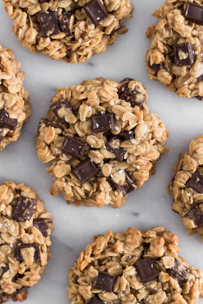 close-up overhead view of oatmeal dark chocolate chunk breakfast cookies on a marble surface