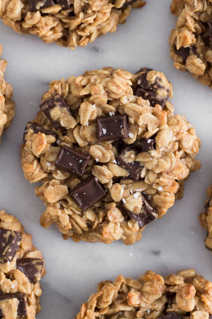 close-up overhead view of oatmeal dark chocolate chunk breakfast cookies on a marble surface