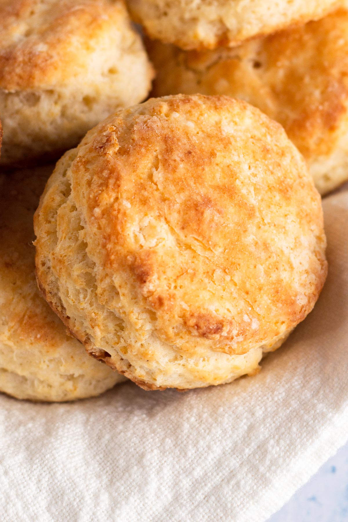 angled view of biscuits on a white linen napkin