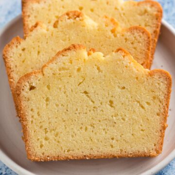 angled view of slices of pound cake on a white plate