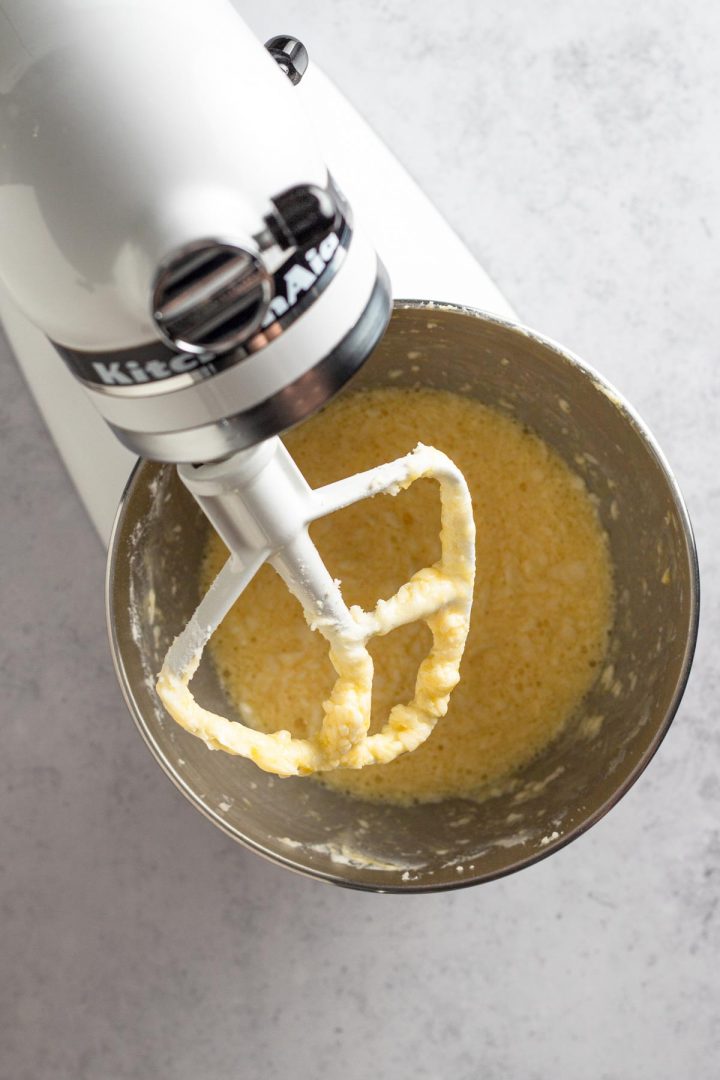 overhead view of wet ingredients in a white stand mixer