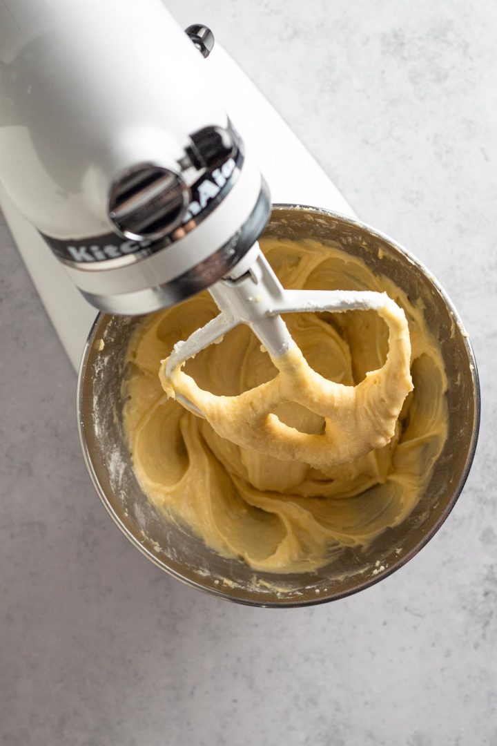 overhead view of cake batter in a white stand mixer