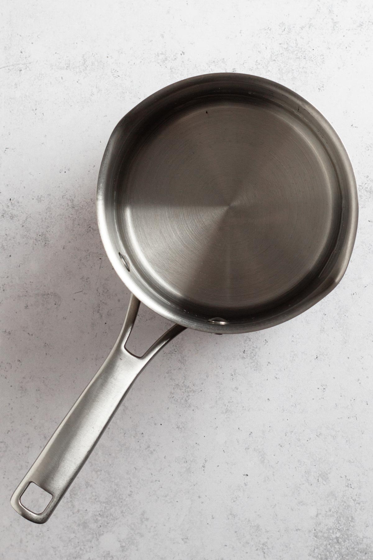 overhead view of water in a saucepan