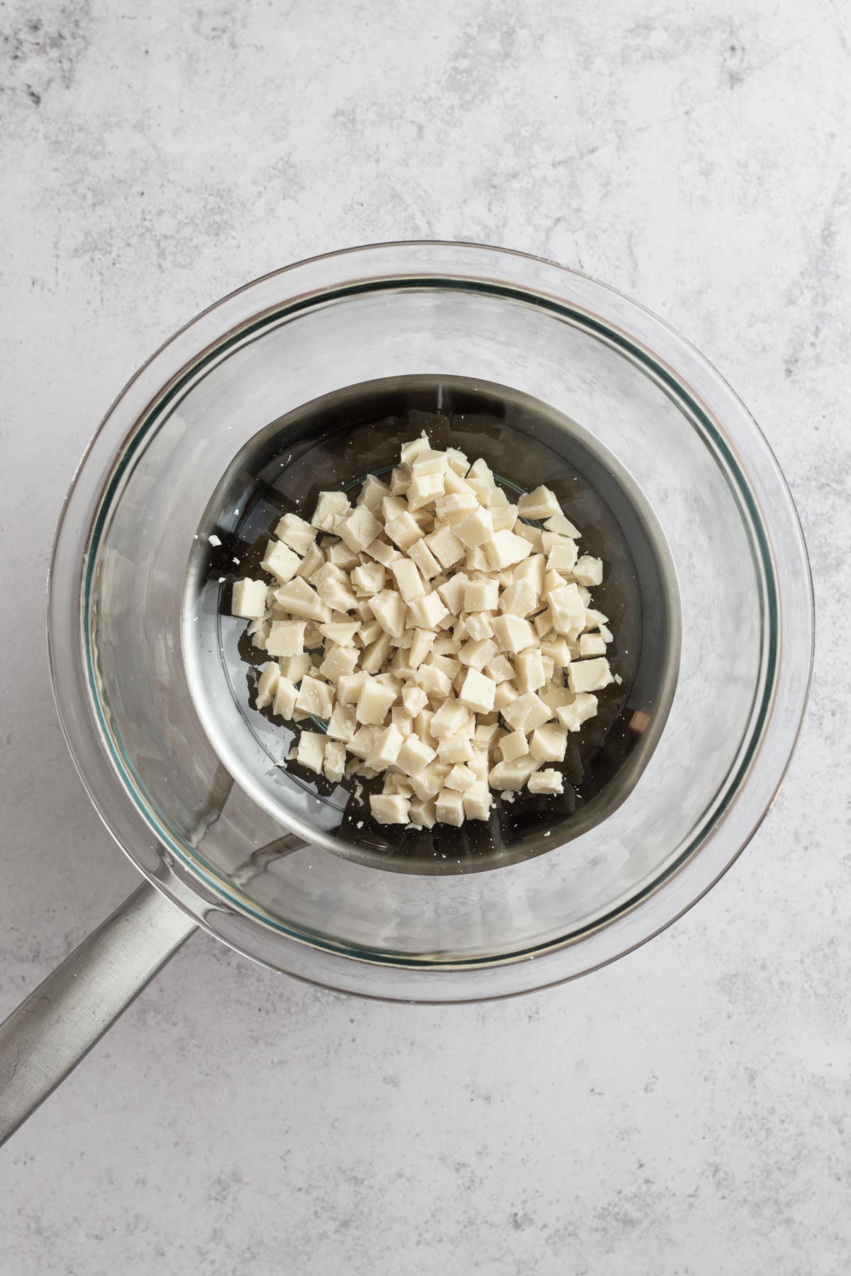 chopped white chocolate in a double boiler