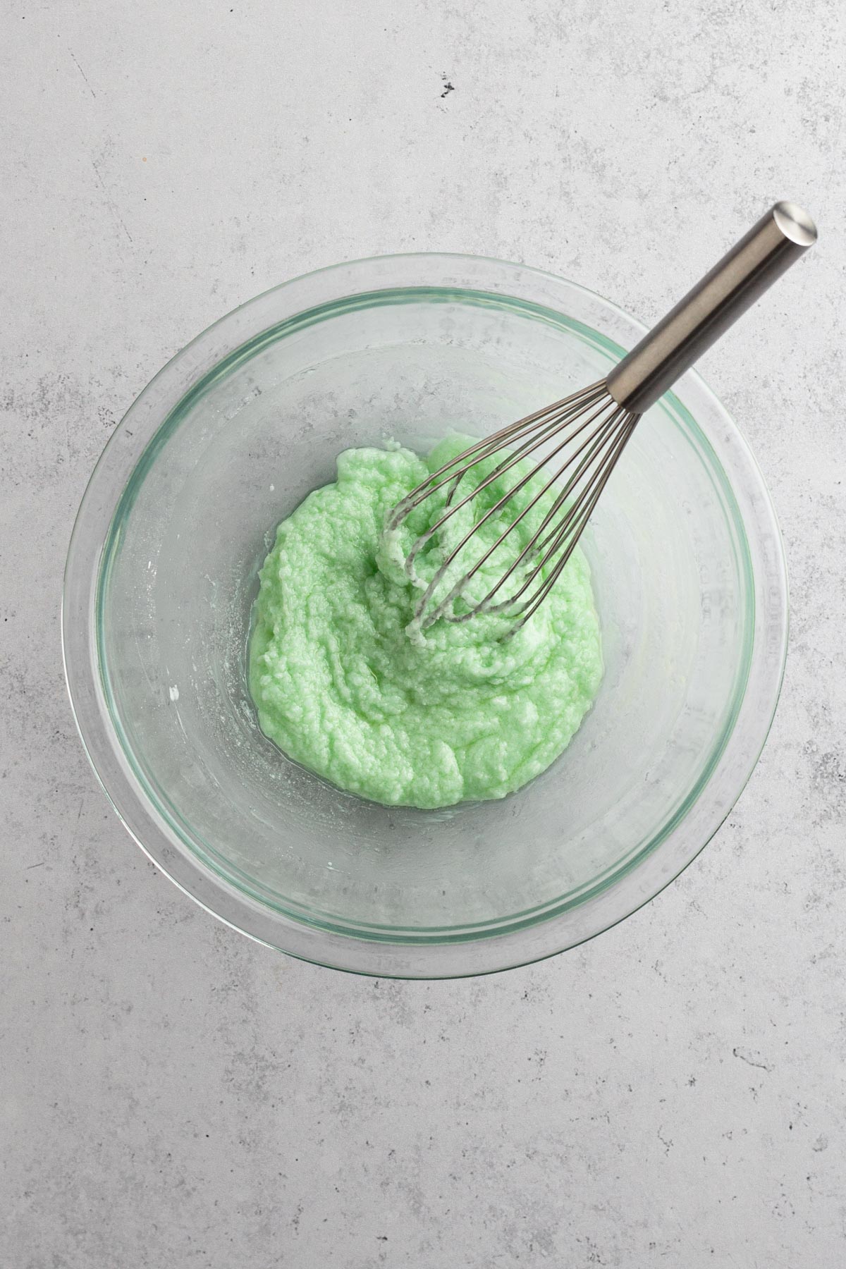 overhead view of creme de menthe frosting in a glass bowl