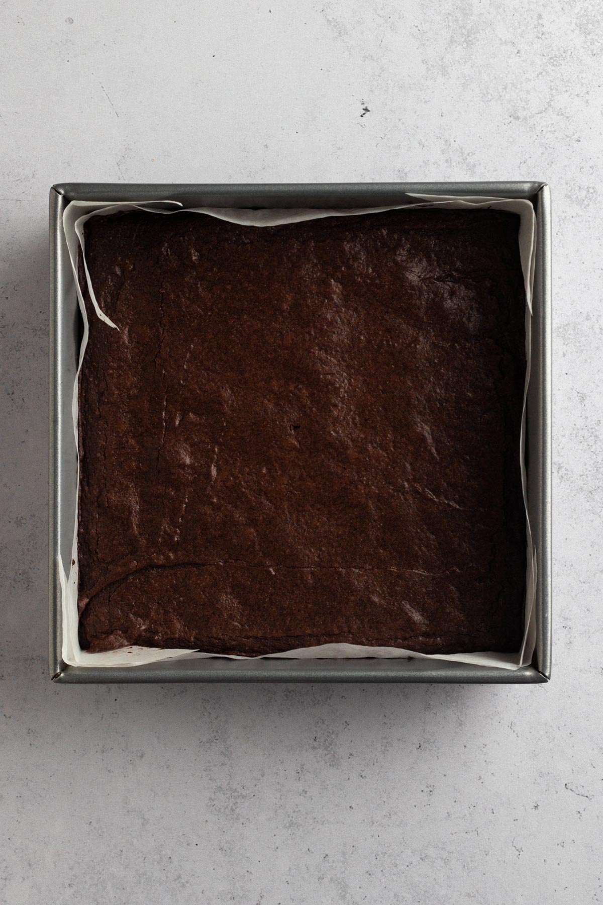 overhead view of baked brownies in a metal pan
