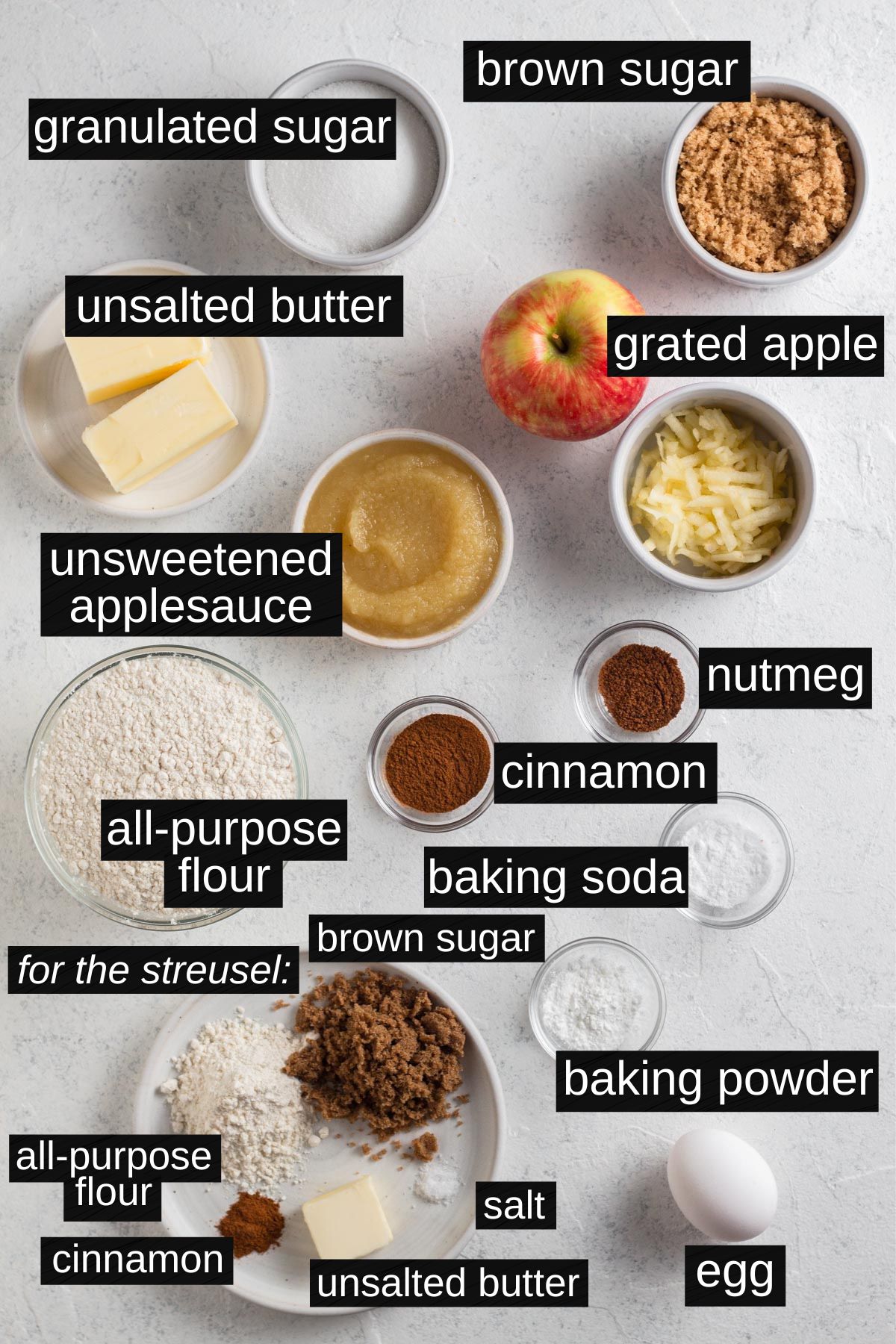Overhead view of recipe ingredients on a white surface.