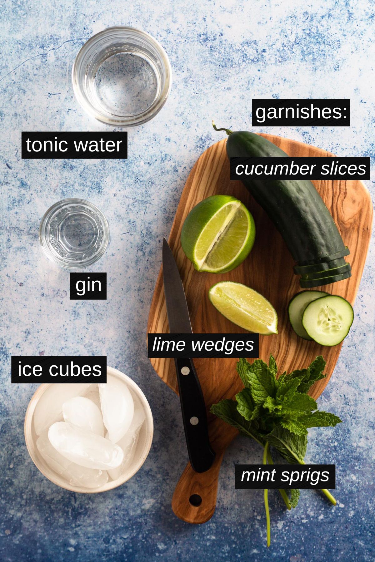 Recipe ingredients with labels on a blue surface.