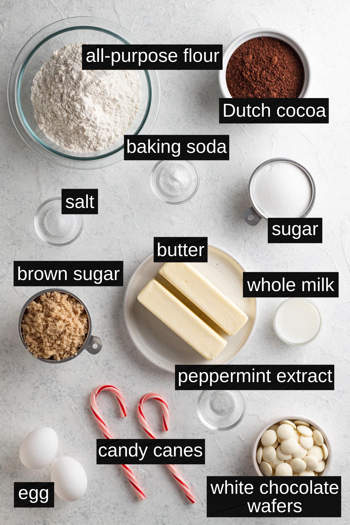 Recipe ingredients with labels on a gray surface.