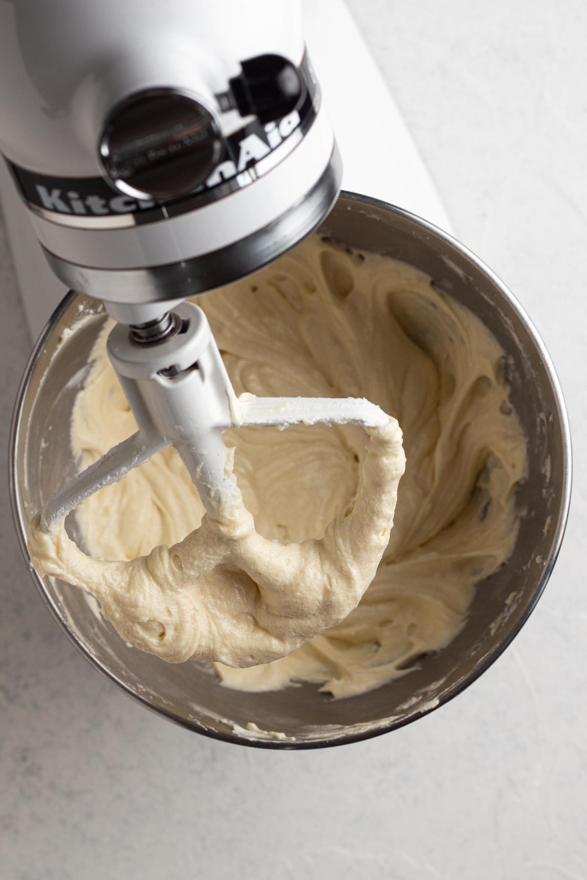 Pound cake batter in the bowl of a stand mixer.