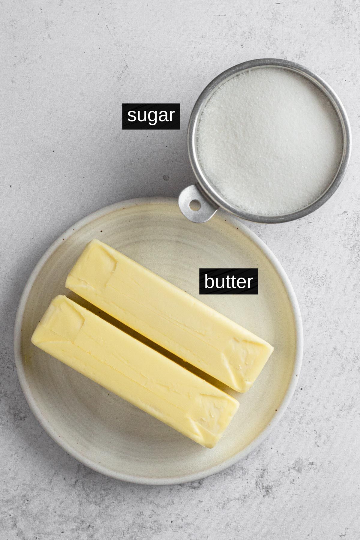 Recipe ingredients with labels on a gray surface.