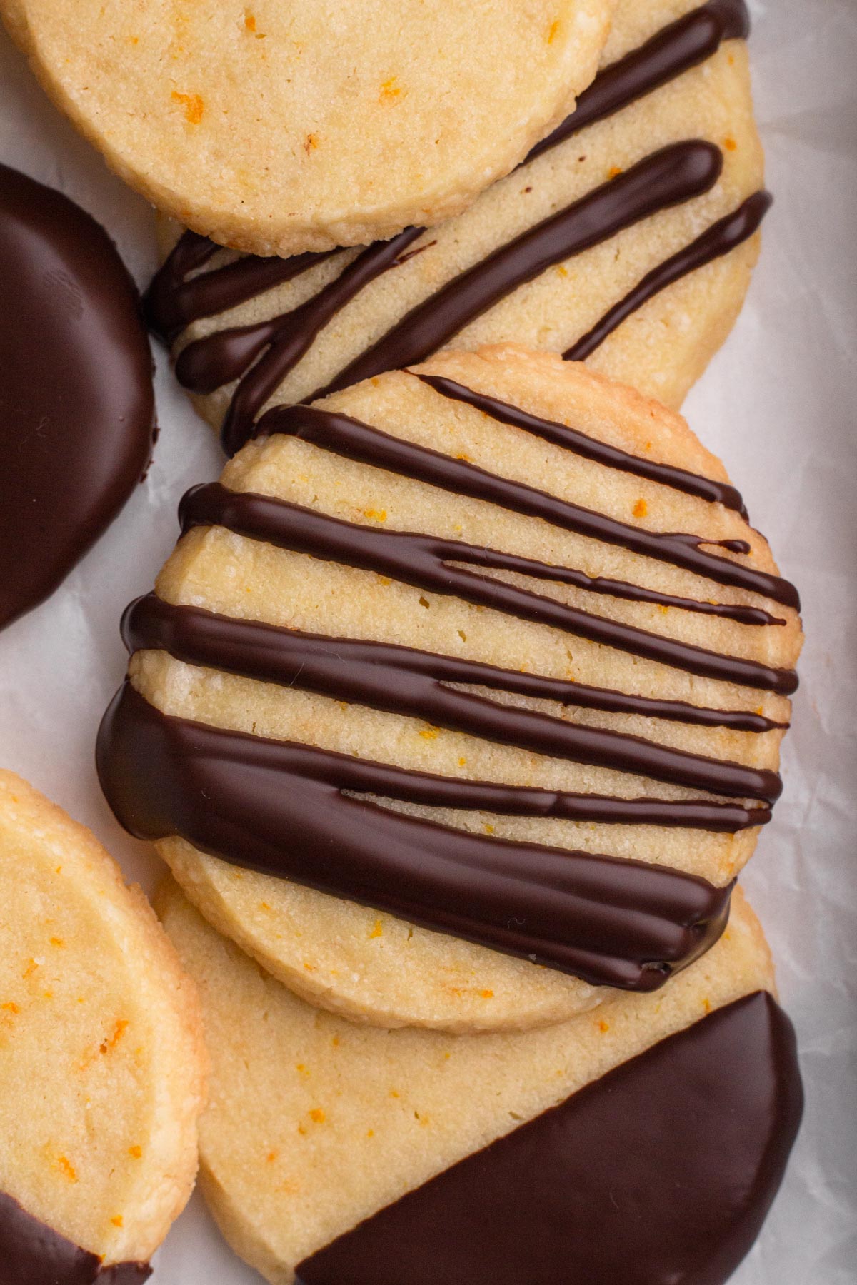 Overhead view of a chocolate-drizzled shortbread cookie.