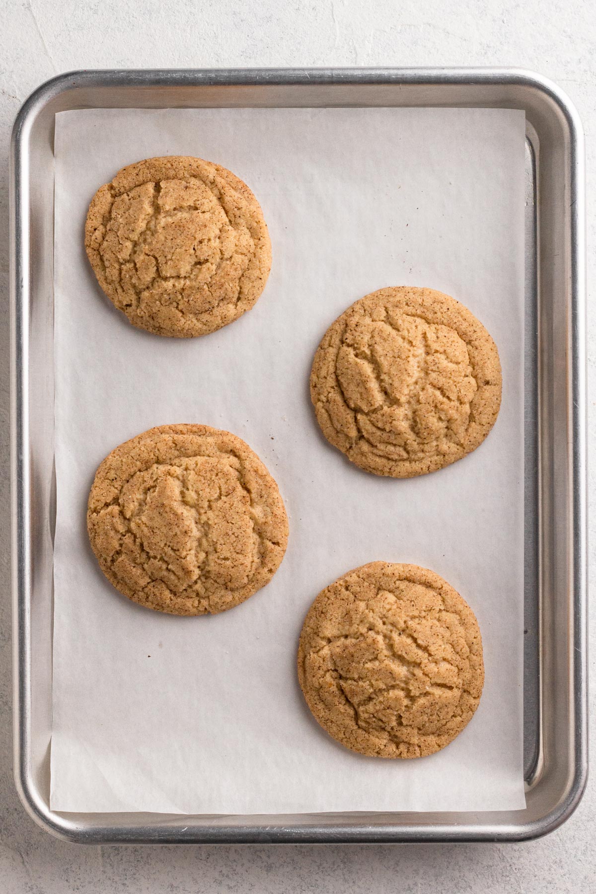 Baked cookies just after they're removed from the oven, with centers that are still slightly puffed.