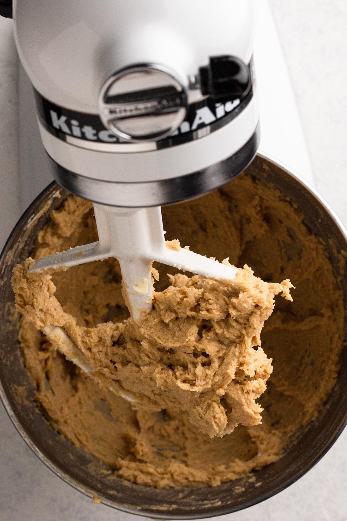 Wet ingredients blended together in the bowl of a stand mixer.