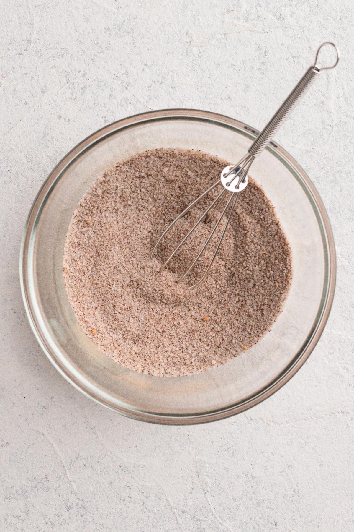 Spiced sugar mixture in a small glass bowl.