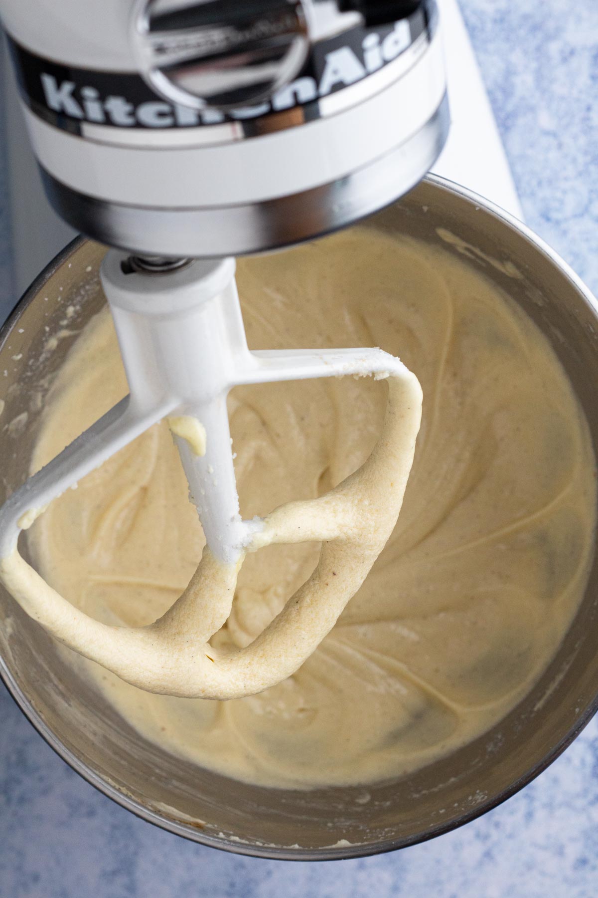 Wet ingredients blended in the bowl of a stand mixer.