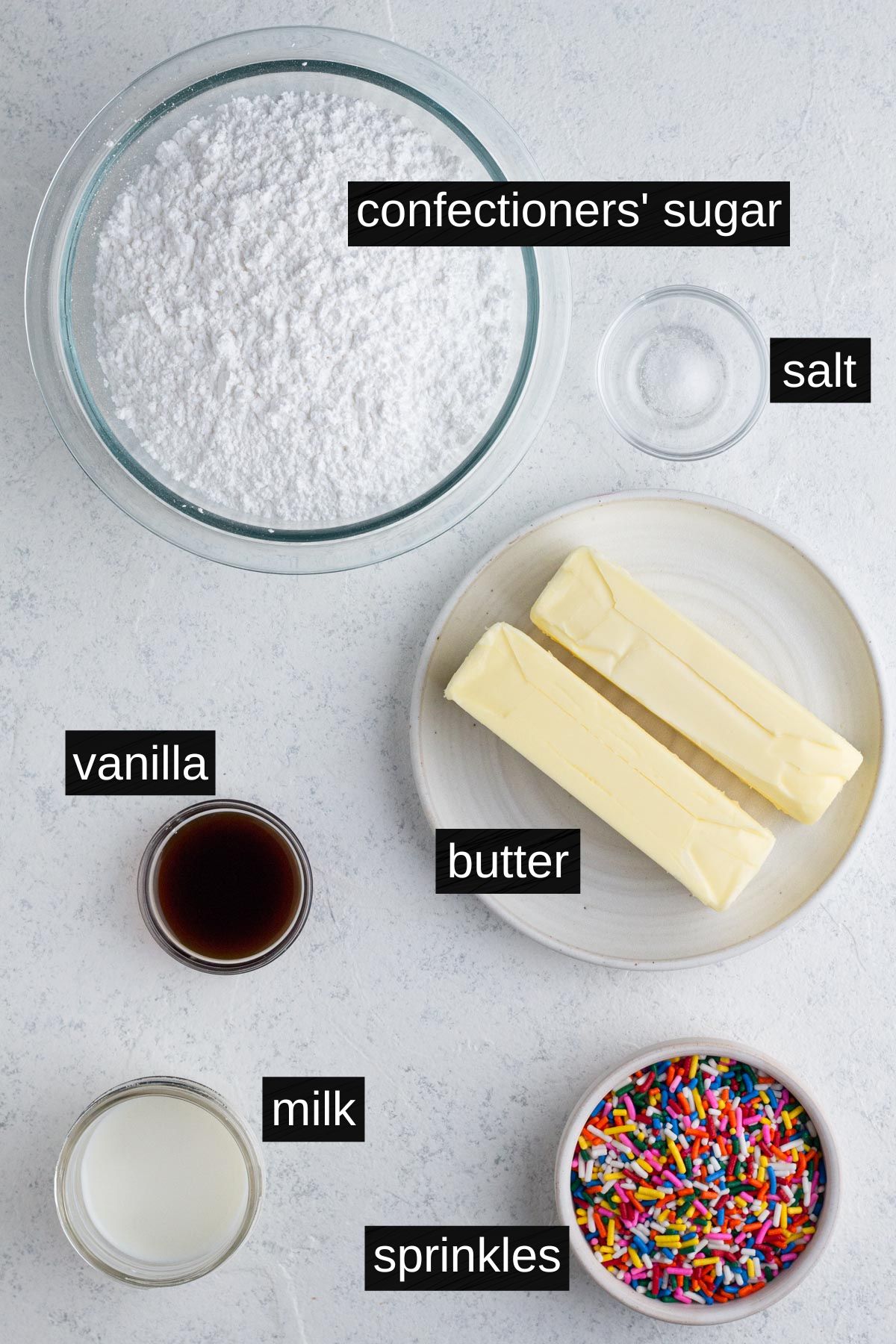 Frosting ingredients with labels on a white background.
