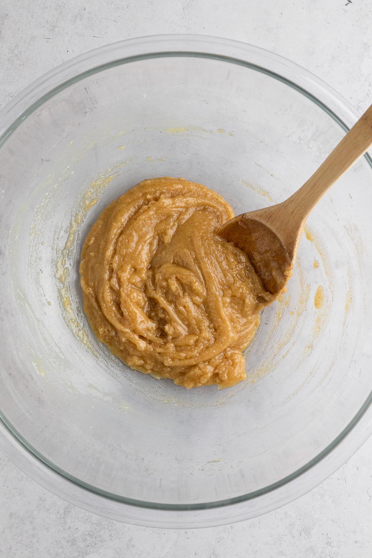 Cupcake batter in a glass bowl.