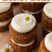 Overhead view of tiny carrot cakes topped with cream cheese frosting with a text overlay.