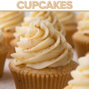 A cupcake topped with swirls of frosting and a sprinkle of ground nutmeg with a text overlay.
