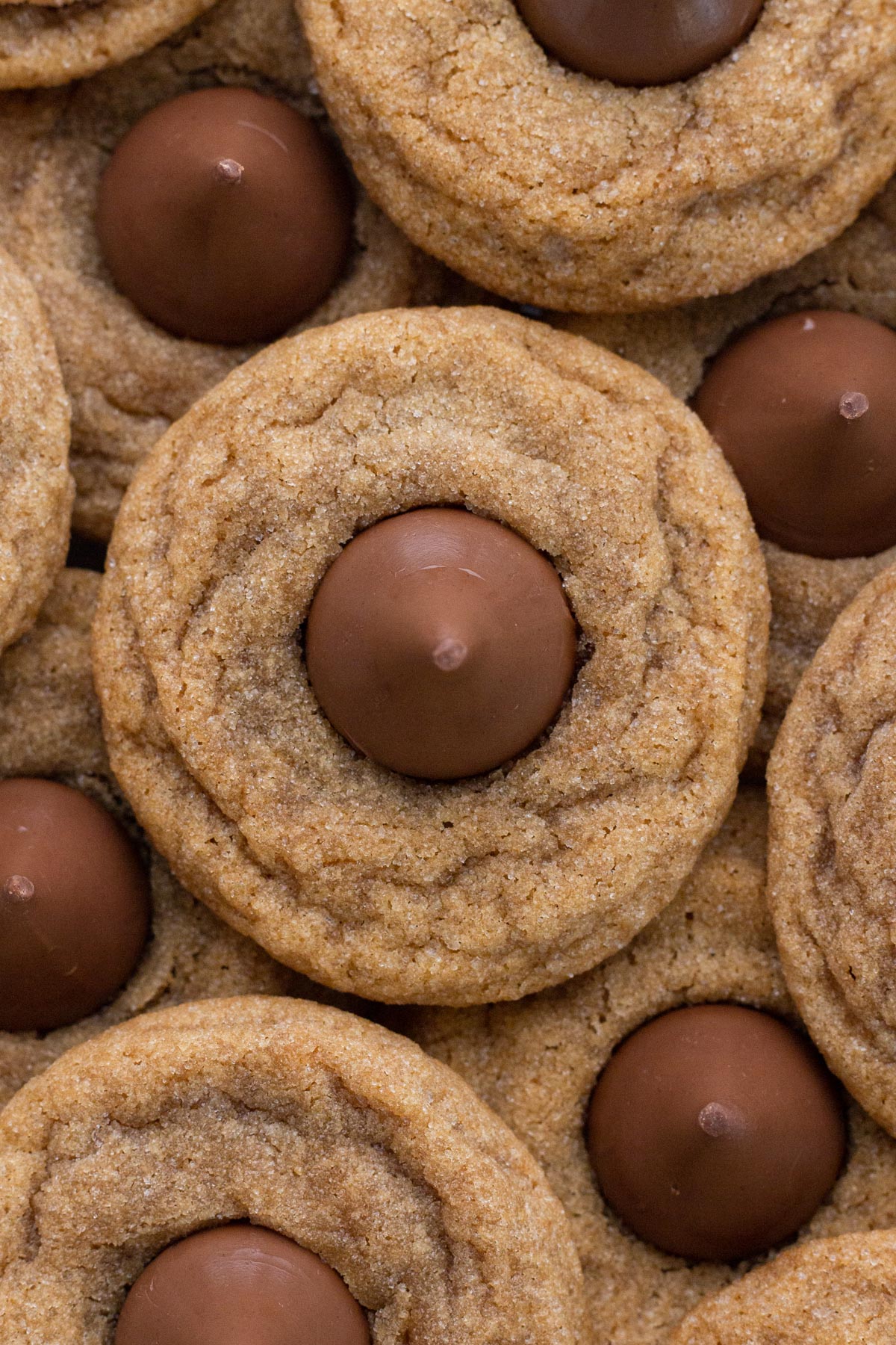 Overhead view of stacked cookie butter kiss cookies.