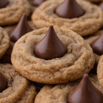 Stacked cookies topped with chocolate kisses.