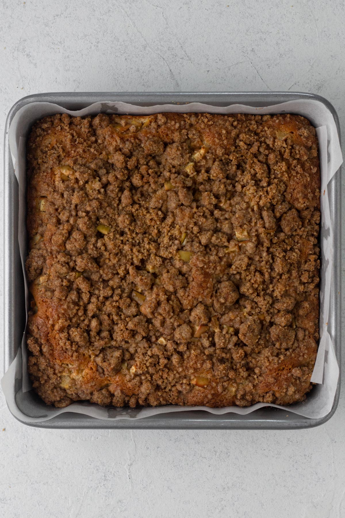 Baked coffee cake in a square baking pan.