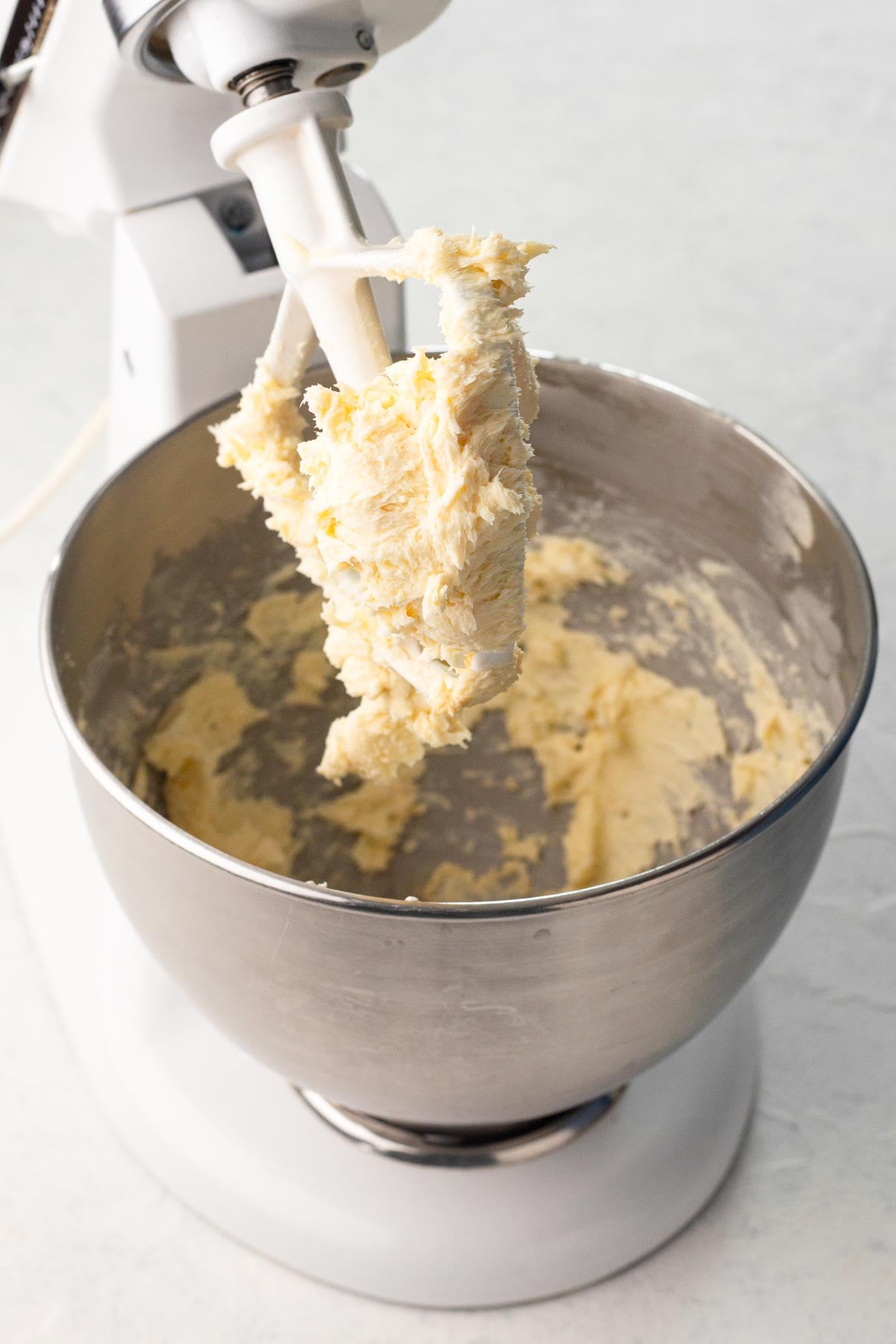 Butter beaten with vanilla and salt in the bowl of a stand mixer.