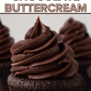 Close-up view of a tall swirl of chocolate frosting on top of a chocolate cupcake with a text overlay.
