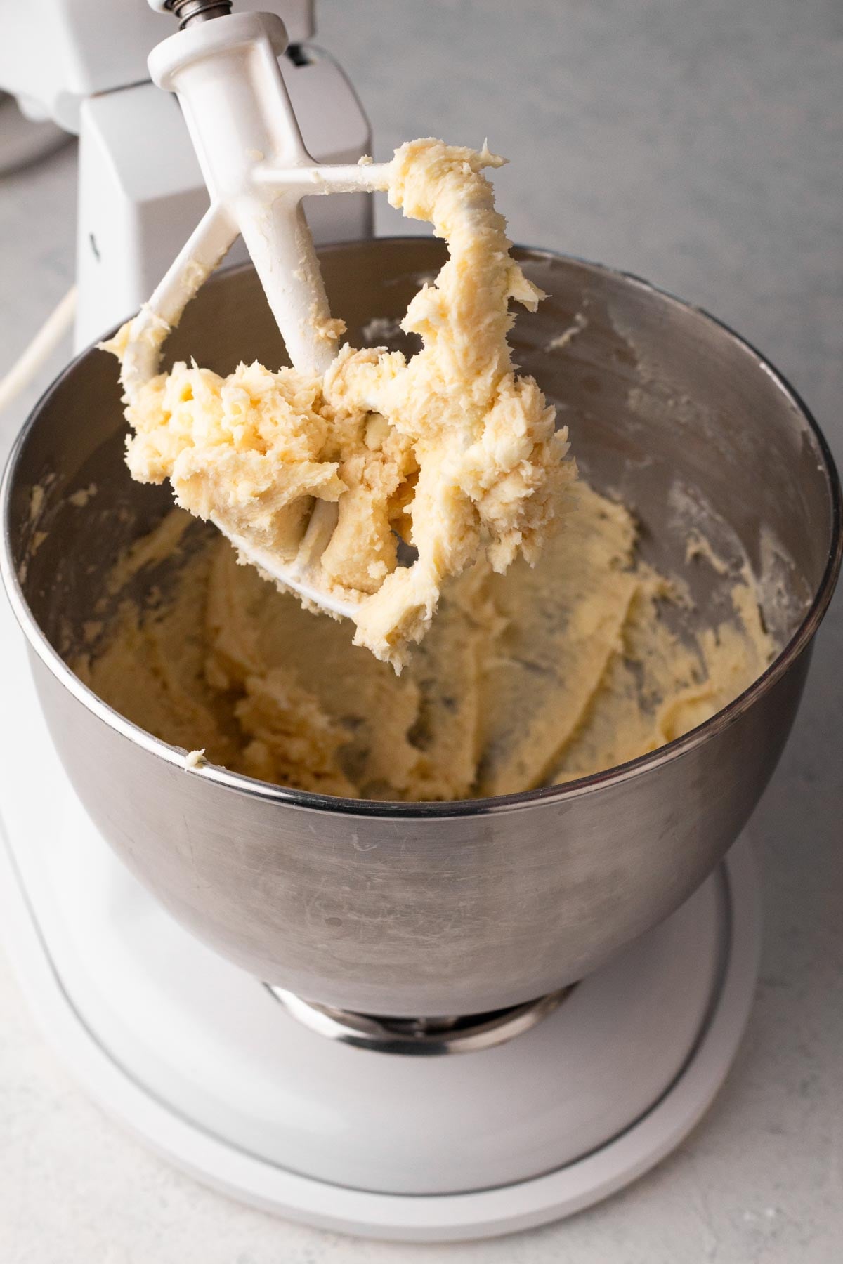 Butter and sugar creamed together in the bowl of a stand mixer.